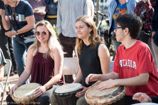 Acadia students at teh Deep Roots Music Festival drum circle